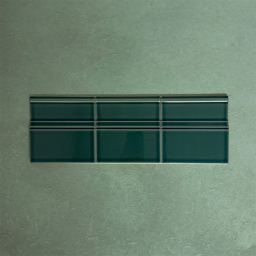 Flat lay of Finchley Golders Green 15 × 15cm ceramic skirting tiles with a crackle glaze finish, designed to create a smooth, decorative transition between wall and floor in classic interior spaces.