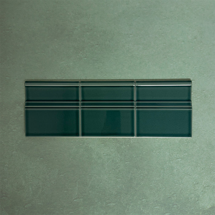 Flat lay of Finchley Golders Green 15 × 15cm ceramic skirting tiles with a crackle glaze finish, designed to create a smooth, decorative transition between wall and floor in classic interior spaces.