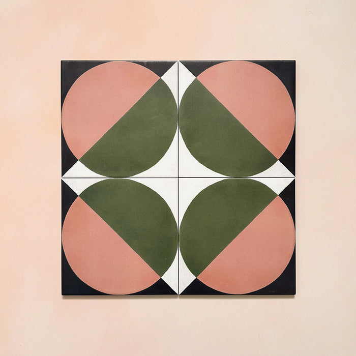 Group image showing four Geometry Moon 20x20cm geometric patterned tiles arranged to form a circular motif, featuring green and terracotta semicircles with black and cream corner details, photographed against a soft peach-toned background.