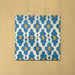 Cabana Zafini Mustard Azure 20x20cm Moroccan-style porcelain tiles arranged in a four-tile layout, displaying a repeating geometric pattern in vibrant azure blue and mustard yellow on a cream base with a smooth matt finish.