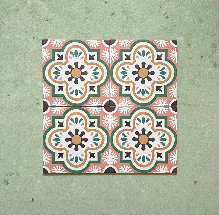 Cabana Paradise 20x20cm Moroccan-style ceramic tiles shown as a four-tile display, featuring a pink, green, and mustard floral pattern on a soft green background.