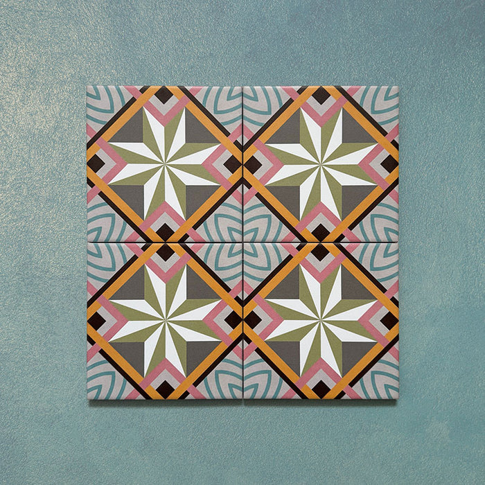 Cabana Star Mini 15x15cm Moroccan-style ceramic tiles shown as a four-tile display, featuring a multicolour geometric star pattern on a teal background.