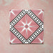 Galata Pink Moroccan Style 20x20cm four-tile layout featuring a bold geometric star and diamond motif in blush pink, white, and black with a smooth matt finish, displayed on a textured pink background.