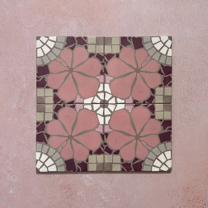 Four Bloom Rose Pink 20x20cm Moroccan-style ceramic tiles displayed together, featuring a symmetrical floral pattern in blush pink, burgundy, taupe, and white tones on a soft pink background.