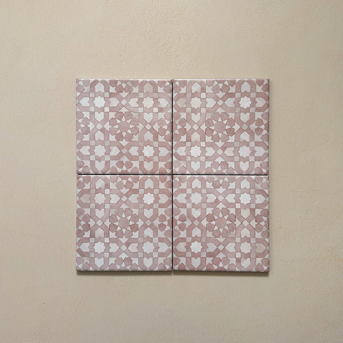 Bedouin Tetuan Rose Moroccan-style 15x15cm four-tile arrangement featuring a soft blush pink and white geometric pattern. The tiles have a handcrafted matte finish with subtle tonal variation, displayed on a warm neutral background to highlight their artisanal design.