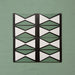 Group image showing four Geometry Hourglass 20x20cm patterned tiles arranged in a repeating vertical design, featuring alternating green and cream hourglass shapes outlined in charcoal, photographed against a textured sage-green background.