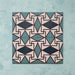 Group image showing four Geometry Iris 20x20cm patterned tiles arranged to form a continuous geometric motif in teal, navy, terracotta-red, and cream, photographed against a soft mottled aqua background.