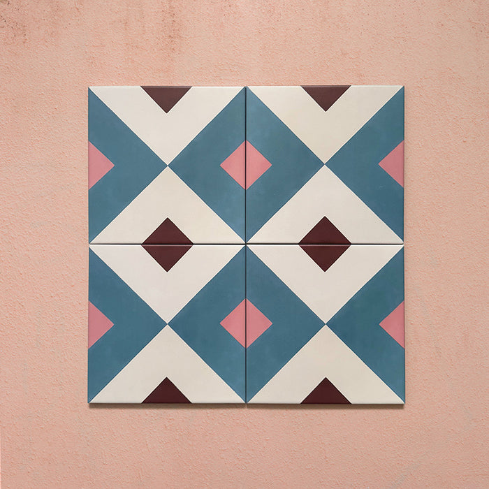 Cabana Guazzatto 20x20cm Moroccan-style porcelain tiles shown in a set of four, featuring a bold geometric diamond pattern in blue, cream, pink, and burgundy tones with a smooth matt finish
