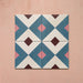 Cabana Guazzatto 20x20cm Moroccan-style porcelain tiles shown in a set of four, featuring a bold geometric diamond pattern in blue, cream, pink, and burgundy tones with a smooth matt finish