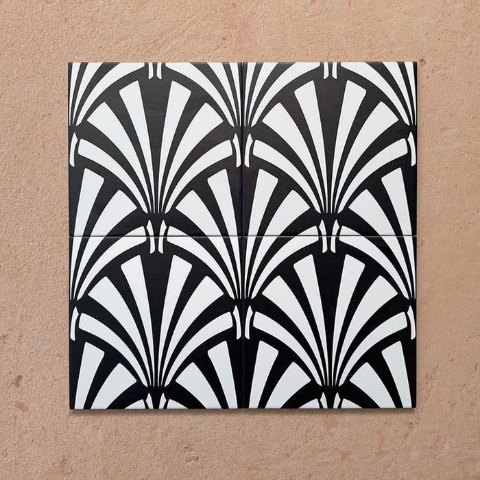 Alhambra Casa 20x20cm Moroccan tiles shown in a four-tile layout, featuring a bold black and white fan pattern inspired by Art Deco design, ideal for statement walls or stylish interiors.