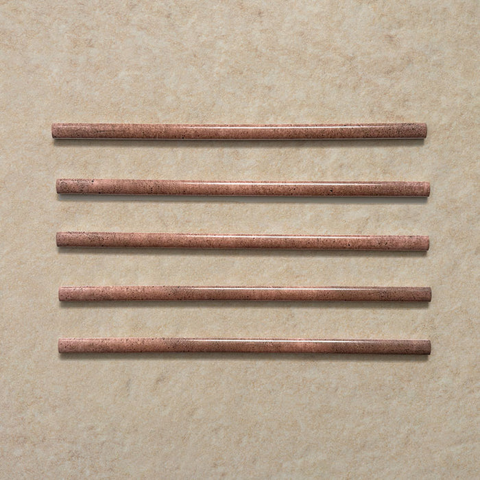 Izmir Tusk Rose Gloss Pencil Bullnose Border Tile 1.2x30cm — set of five borders. Each piece showcases the soft blush and terracotta hues of the Tusk Rose glaze, finished with a glossy, handcrafted look. Perfect for adding a refined finishing touch or framing tiled areas with subtle warmth and character.