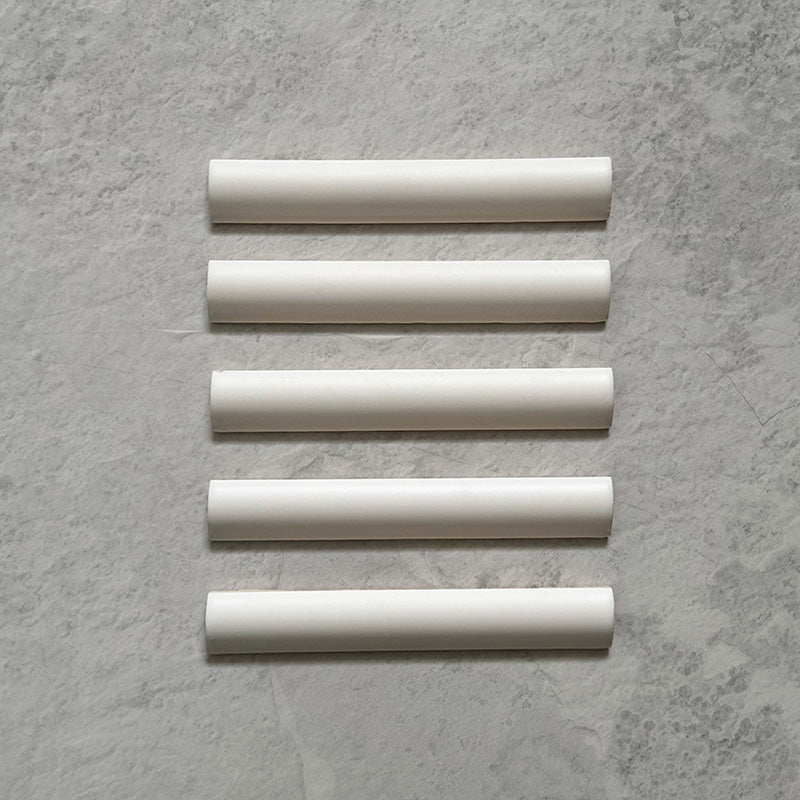 Zellij Chalk White Bullnose Moroccan-style trims in a 3cm x 20cm format, featuring a soft matt white finish and smooth rounded profile, displayed as a flat lay on a neutral stone-effect background.