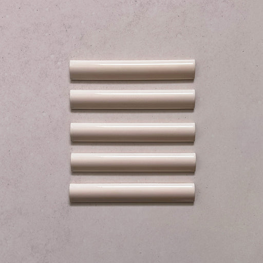 Zellij Pink Mist bullnose trim tile, 3cm x 20cm, soft blush pink tone, glossy glazed finish, smooth rounded edge, handcrafted Moroccan style.