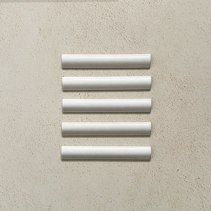 Zellij White Gloss Bullnose Moroccan-style trims in a 3cm x 20cm format, featuring a glossy white glaze and smooth rounded profile, displayed as a flat lay on a neutral background.