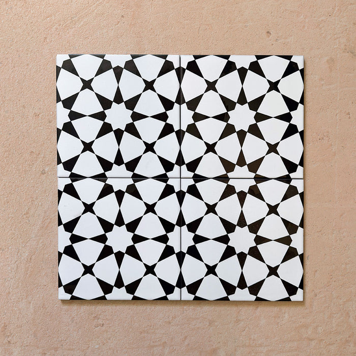Agraba Black and White 20x20cm Moroccan-style ceramic tile with geometric star pattern, suitable for walls and floors.