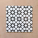 Agraba Black and White 20x20cm Moroccan-style ceramic tile with geometric star pattern, suitable for walls and floors.