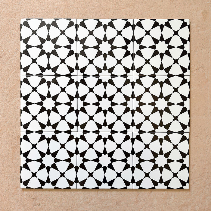 Agraba Black and White 20x20cm Moroccan-style ceramic tile with geometric star pattern, suitable for walls and floors.