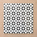 Agraba Black and White 20x20cm Moroccan-style ceramic tile with geometric star pattern, suitable for walls and floors.