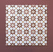 Close-up of multiple Agraba Cotto 20x20cm Moroccan-style ceramic tiles arranged in a grid, showing a geometric star pattern in terracotta, beige, mustard, and white tones on a warm burgundy background.