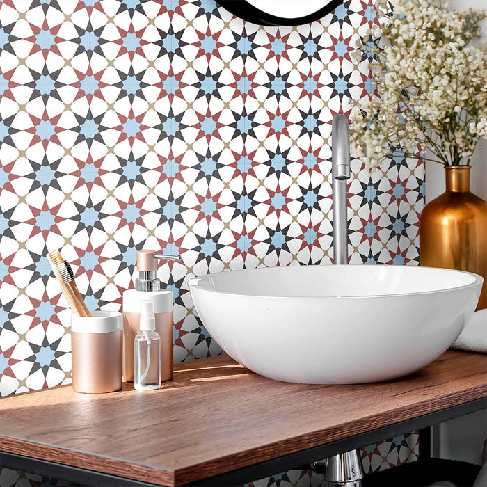 Bathroom featuring Agraba Mini Atlas 15x15cm Moroccan-style ceramic wall tiles in blue, terracotta, and white tones, styled with a modern round basin, wooden countertop, and metallic accents for a contemporary finish.