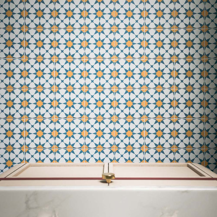 Agraba Sunshine 20cm x 20cm Moroccan style tiles, showcasing a repeating geometric star pattern in rich blue, crisp white and warm ochre, creating a bold and colourful statement wall.