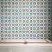 Agraba Sunshine 20cm x 20cm Moroccan style tiles, showcasing a repeating geometric star pattern in rich blue, crisp white and warm ochre, creating a bold and colourful statement wall.