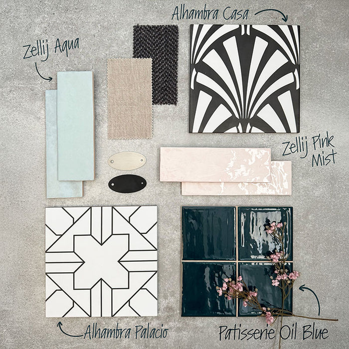 Interior design moodboard featuring Alhambra Casa 20x20cm Moroccan tile with its bold black and white fan pattern, paired with Zellij Aqua, Zellij Pink Mist, Alhambra Palacio, and Patisserie Oil Blue tiles — styled with soft fabric swatches and accessories for modern home inspiration.