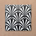 Alhambra Casa 20x20cm Moroccan tiles shown in a four-tile layout, featuring a bold black and white fan pattern inspired by Art Deco design, ideal for statement walls or stylish interiors.