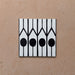 Alhambra Felisa 20x20cm Moroccan single tile featuring a bold black and white geometric pattern with vertical lines and circular shapes inspired by traditional Moroccan design.