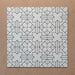 Alhambra Palacio 20x20cm Moroccan tiles displayed in a grouped layout, featuring a refined black geometric cross pattern on a crisp white background for a timeless, elegant look.