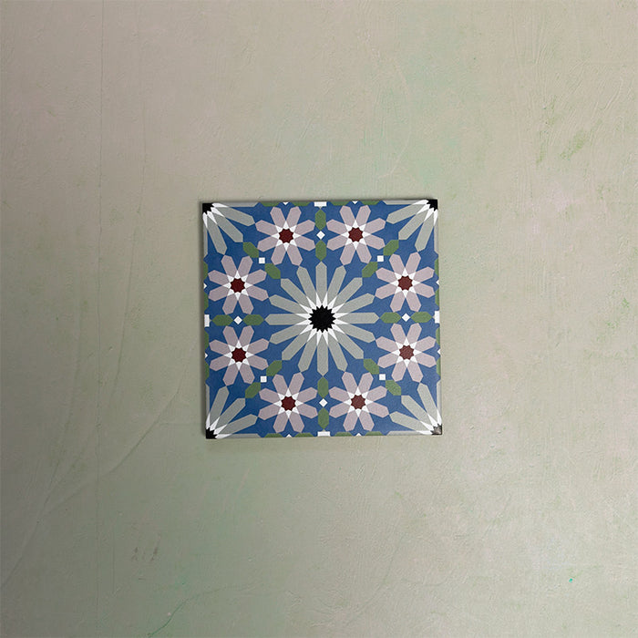 Fizaan Artisan Mini Moroccan-style 15×15cm porcelain tile featuring a blue, green and soft pink geometric star pattern.