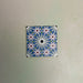 Fizaan Artisan Mini Moroccan-style 15×15cm porcelain tile featuring a blue, green and soft pink geometric star pattern.