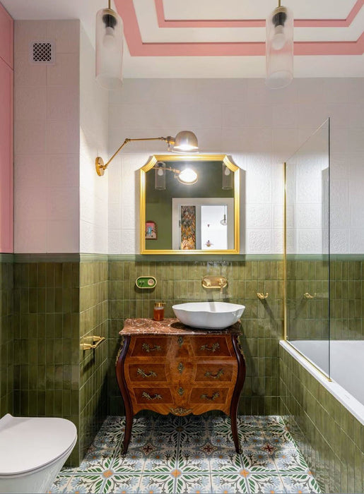 Bathroom featuring Atlas Verde Mini Brick Gloss 5x15cm glossy wall tiles, styled with Moroccan-style patterned floor tiles, vintage wood cabinetry, and brass fixtures for a colourful eclectic bathroom interior.
