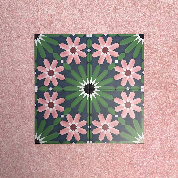 Fizaan Autumn Moroccan-style 20×20cm porcelain tiles laid in a repeating geometric pattern, featuring dark blue, green and pink floral star motifs.