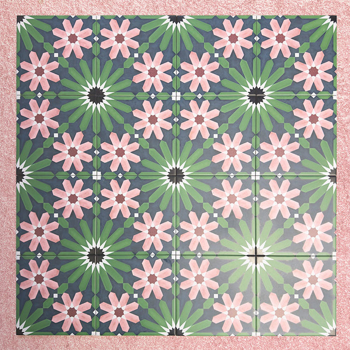Fizaan Autumn Moroccan-style 20×20cm porcelain tiles laid in a repeating geometric pattern, featuring dark blue, green and pink floral star motifs.