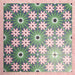 Fizaan Autumn Moroccan-style 20×20cm porcelain tiles laid in a repeating geometric pattern, featuring dark blue, green and pink floral star motifs.