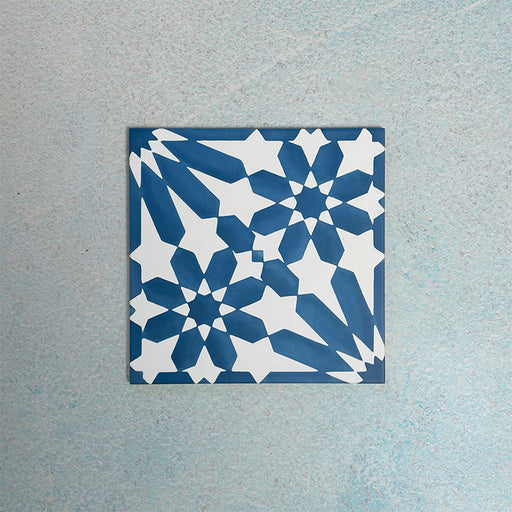 Single Fizaan Azure Blue 20x20cm Moroccan-style porcelain tile featuring a bold geometric pattern in vibrant blue and white tones.