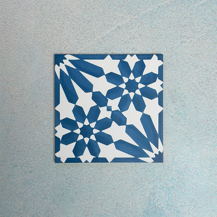 Single Fizaan Azure Blue 20x20cm Moroccan-style porcelain tile featuring a bold geometric pattern in vibrant blue and white tones.