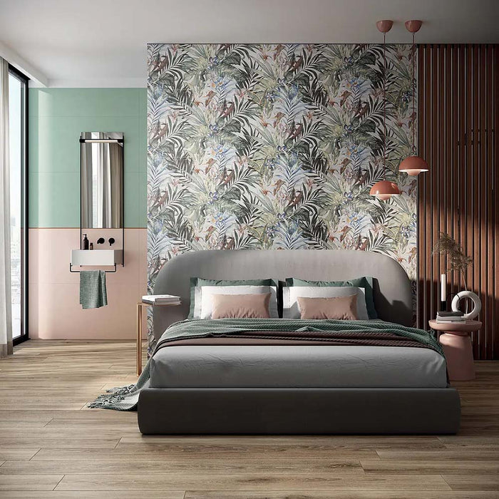 Bedroom featuring Barbados 60 × 120cm wall and floor tiles, used as a statement botanical feature wall with layered tropical detail. Paired with soft furnishings and warm wood tones for a calm, design-led space.