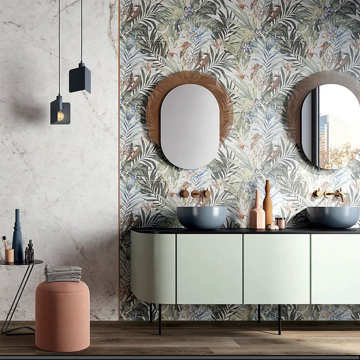 Bathroom featuring Barbados 60 × 120cm wall tiles, creating a bold botanical feature wall with layered tropical detail. Paired with soft tones, wood flooring, and a double vanity for a balanced, design-led space.