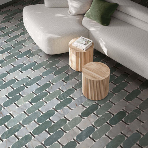 Living area featuring Bassano Abacus 3D Décor 60 × 120cm patterned wall and floor tiles, styled with curved neutral seating, wooden side tables, and soft green tones for a contemporary, design-led interior.