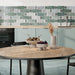 Kitchen interior featuring Bassano Abacus 3D Décor 60 × 120cm patterned wall and floor tiles, styled as a splashback with soft green cabinetry, wooden surfaces, and contemporary neutral accessories for a fresh modern look.