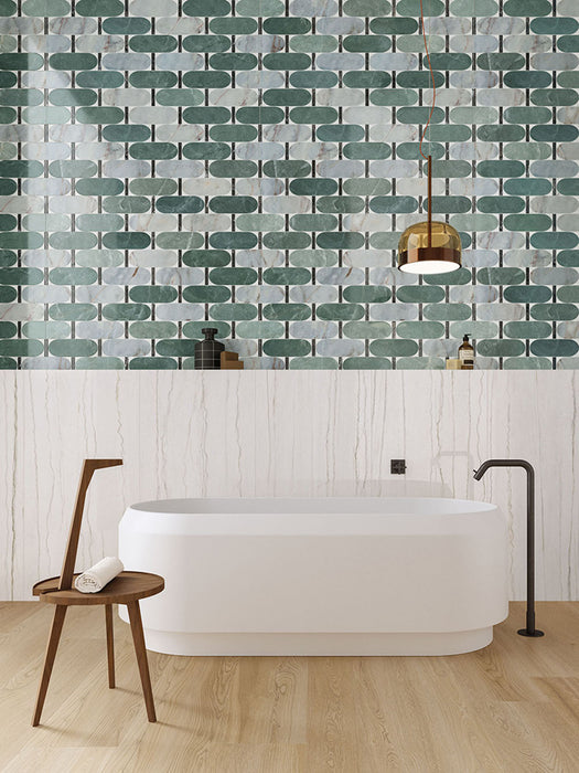 Bathroom interior featuring Bassano Abacus 3D Décor 60 × 120cm patterned wall and floor tiles, styled with a freestanding bath, marble-effect wall panels, warm wood flooring, and contemporary brass lighting.
