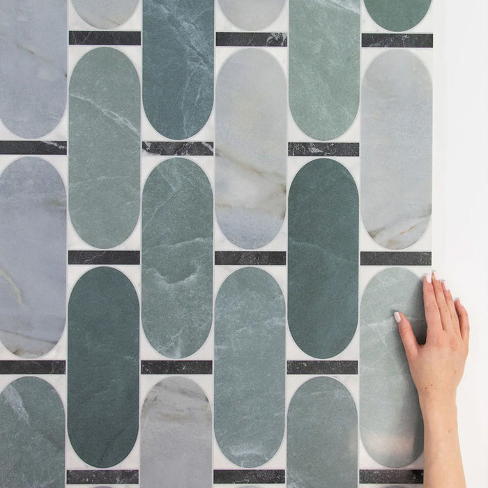 Close-up of Bassano Abacus 3D Décor 60 × 120cm patterned wall and floor tiles, showcasing elongated geometric detailing in soft green and marble-effect tones with a contemporary decorative finish.