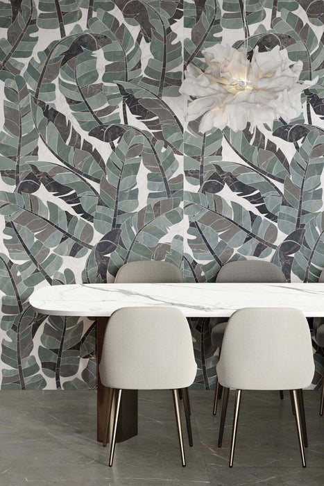 Dining area featuring Bassano Bali 3D Décor 60 × 120cm patterned wall and floor tiles, styled with tropical leaf detailing, marble-effect surfaces, soft neutral seating, and contemporary lighting for a bold interior statement.