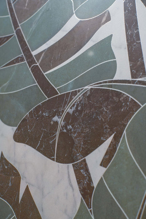 Close-up of Bassano Bali 3D Décor 60 × 120cm patterned wall and floor tiles, showcasing layered tropical leaf detailing, soft green tones, and contrasting marble-effect textures with a contemporary decorative finish.