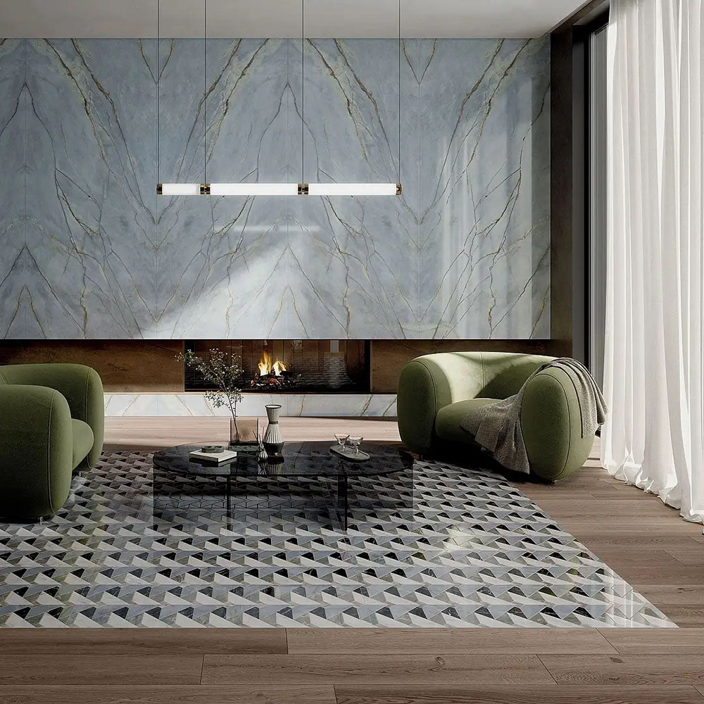 Living room featuring Bassano Diamond Tips 3D Décor 60 × 120cm patterned wall and floor tiles, styled with marble-effect feature walls, sculptural green seating, wood flooring, and contemporary lighting for a luxurious modern interior.