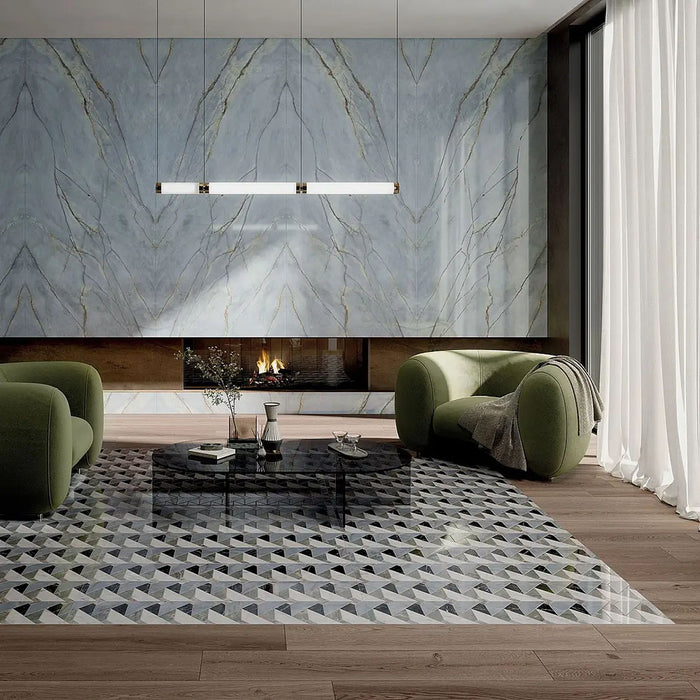 Living room featuring Bassano Diamond Tips 3D Décor 60 × 120cm patterned wall and floor tiles, styled with marble-effect feature walls, sculptural green seating, wood flooring, and contemporary lighting for a luxurious modern interior.