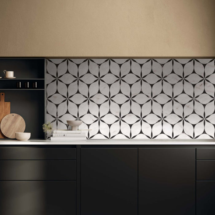 Kitchen interior featuring Bassano Flowers 3D Décor 60 × 120cm patterned wall and floor tiles, styled as a statement splashback with dark cabinetry, warm neutral walls, and contemporary wooden accessories.