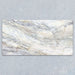 Bassano Quartz Lux 3D 60 × 120cm marble-effect wall and floor tile featuring soft white tones with flowing grey and gold veining and a luxurious contemporary polished finish.